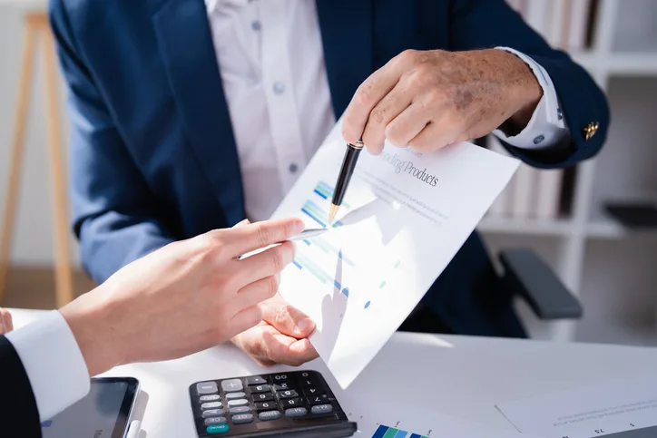 Financial advisor reviewing a chart with a client